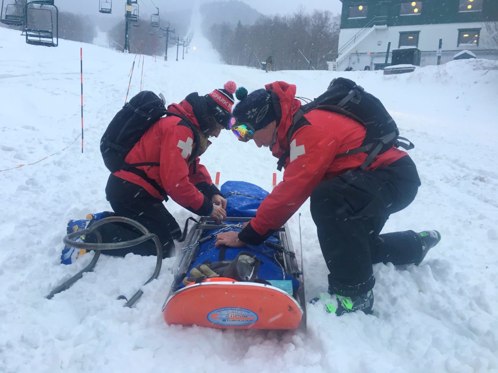 Ski Patrollers Load Patient Min Scaled 