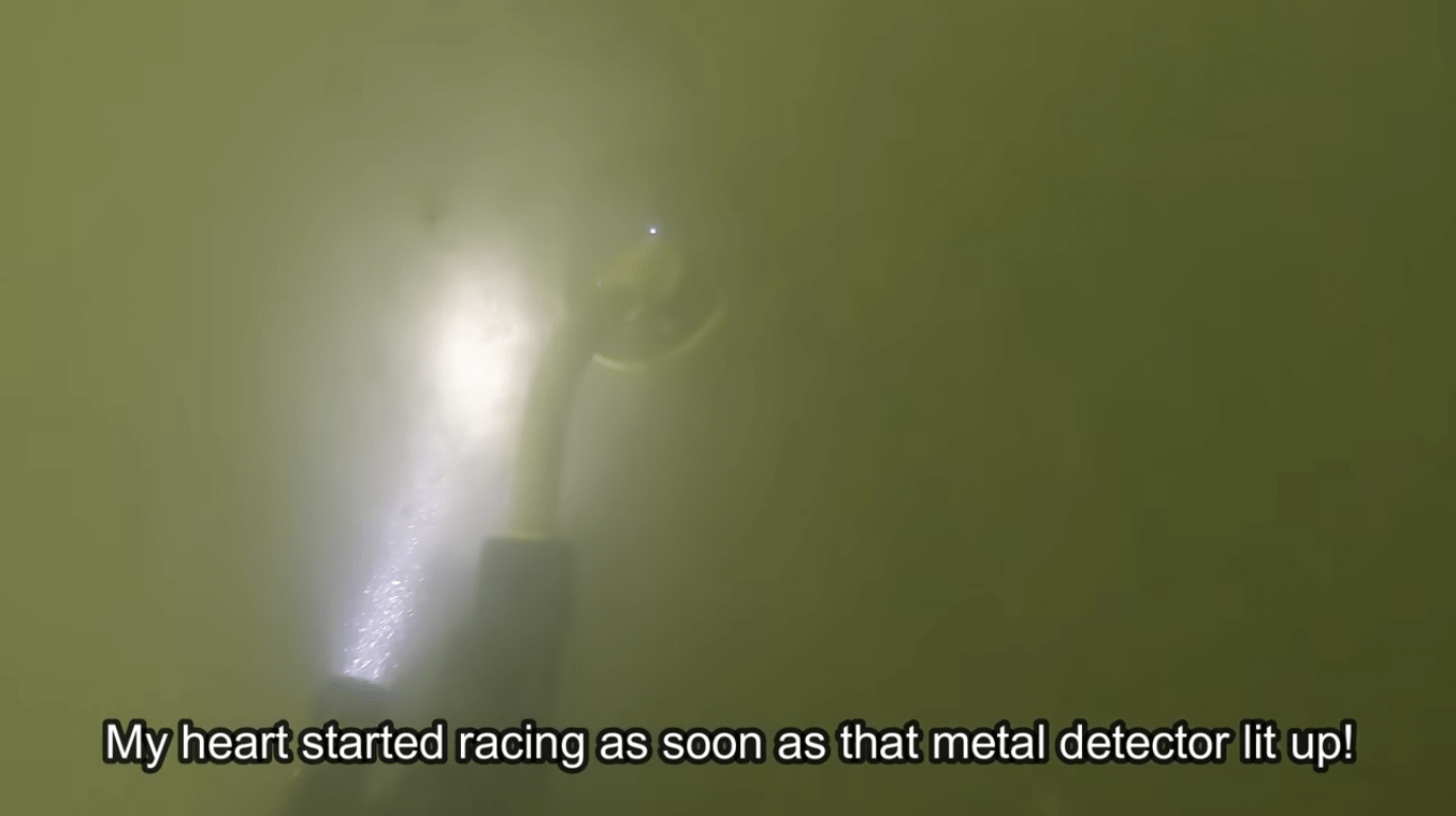 metal detector in the water, river