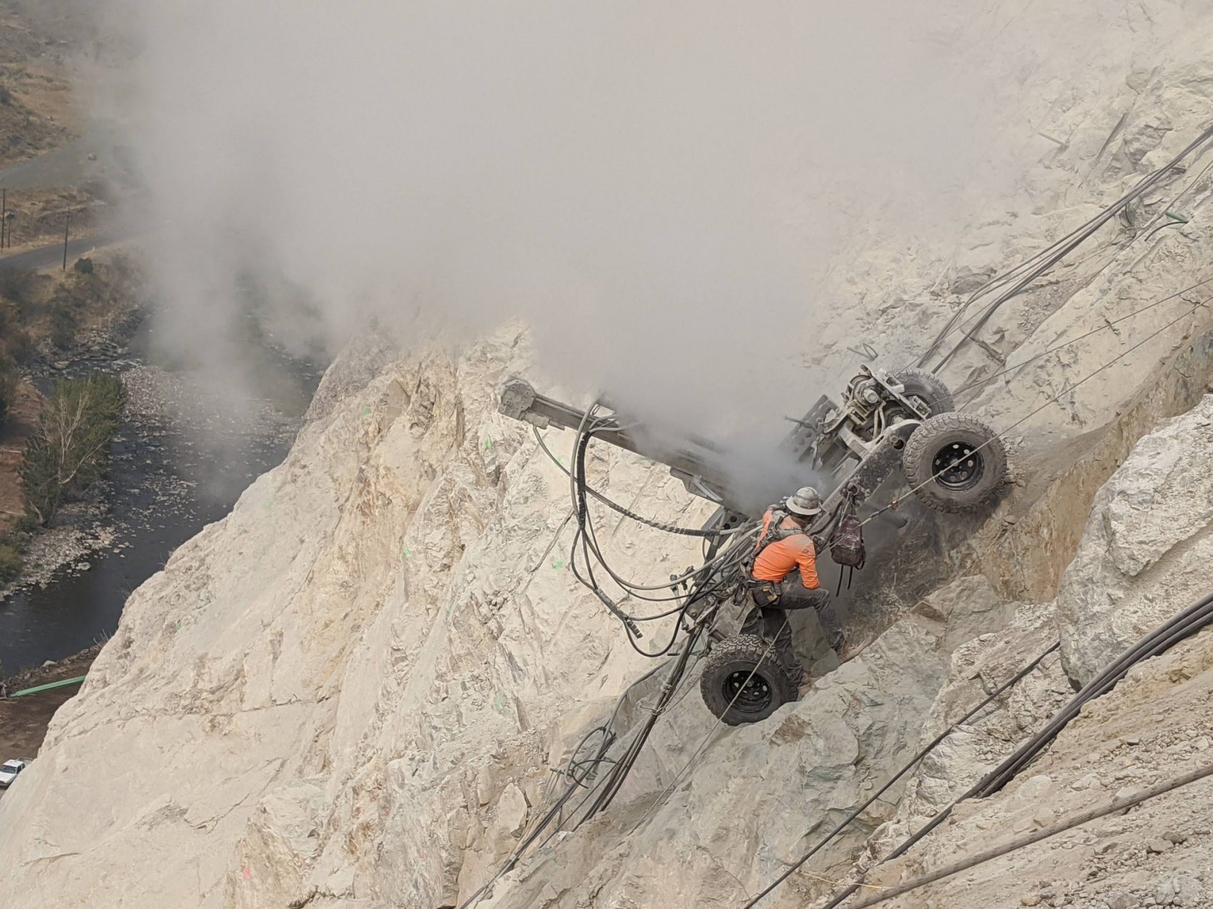 Rock climbers drilling