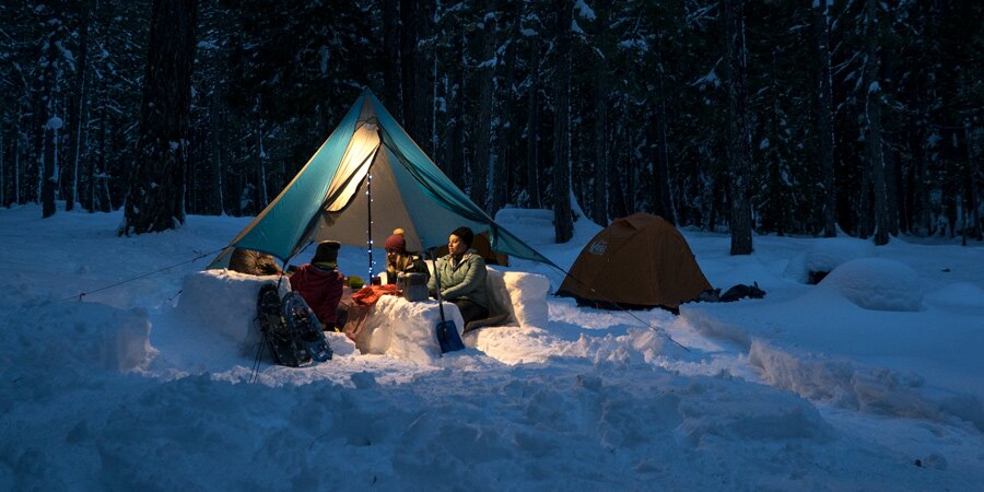 Tips and tricks to stay warm while camping this winter