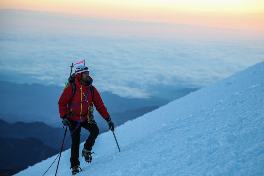 A mountaineer ascends a slope.
