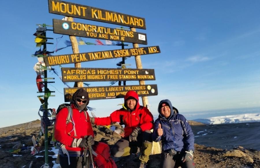 Climbers on the Summit of Kilimanjaro, a prominent mountain peak that is a popular location for cases of HAPE and HACE.