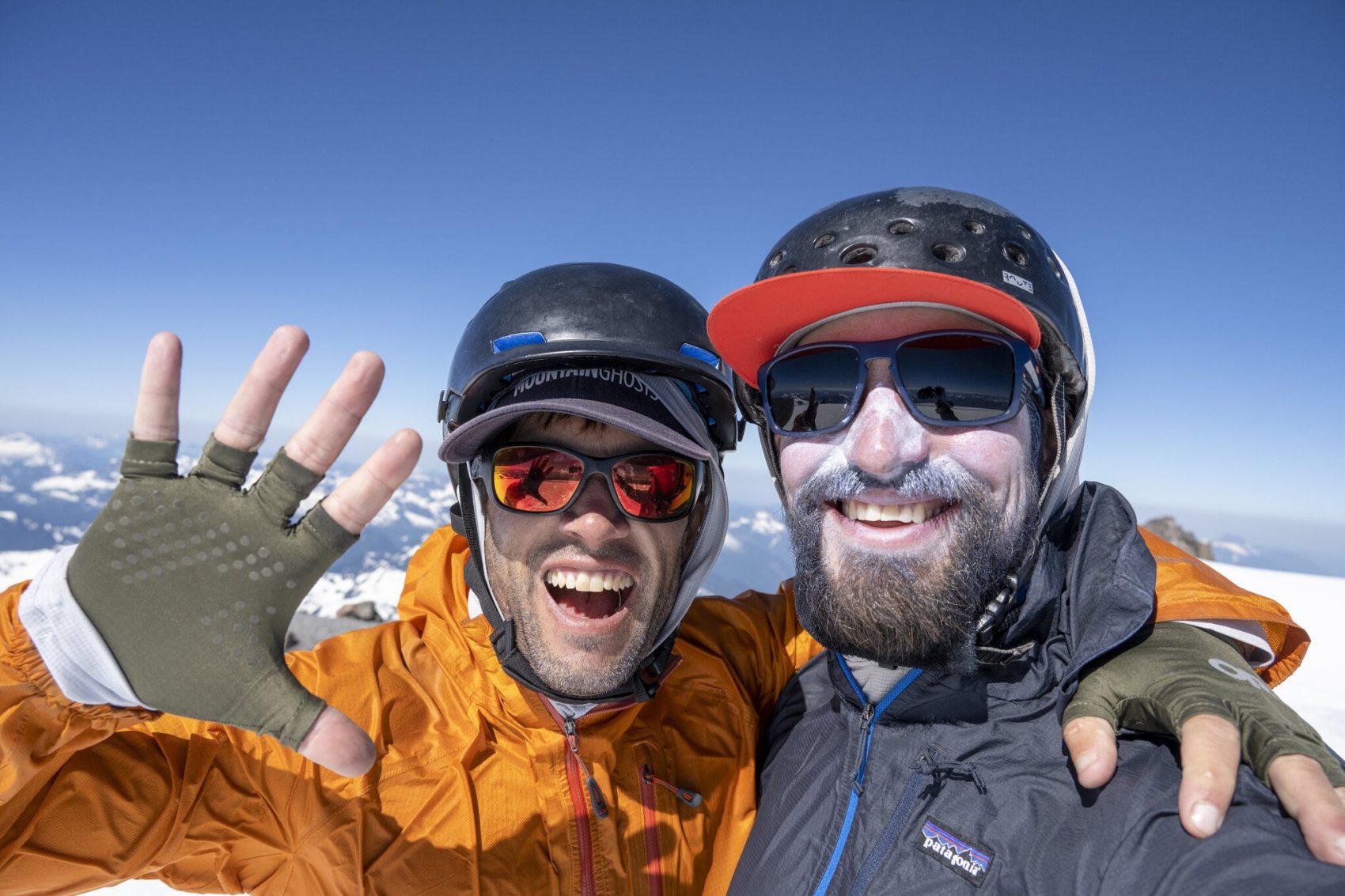 Two men on mountain summit
