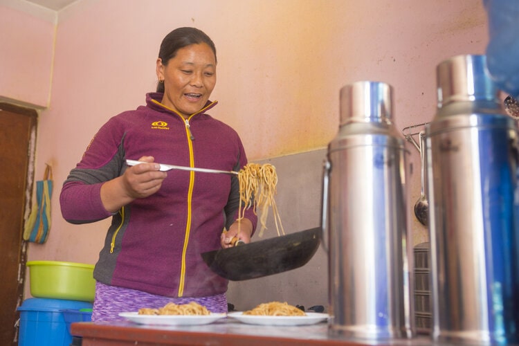 Woman cooks a meal