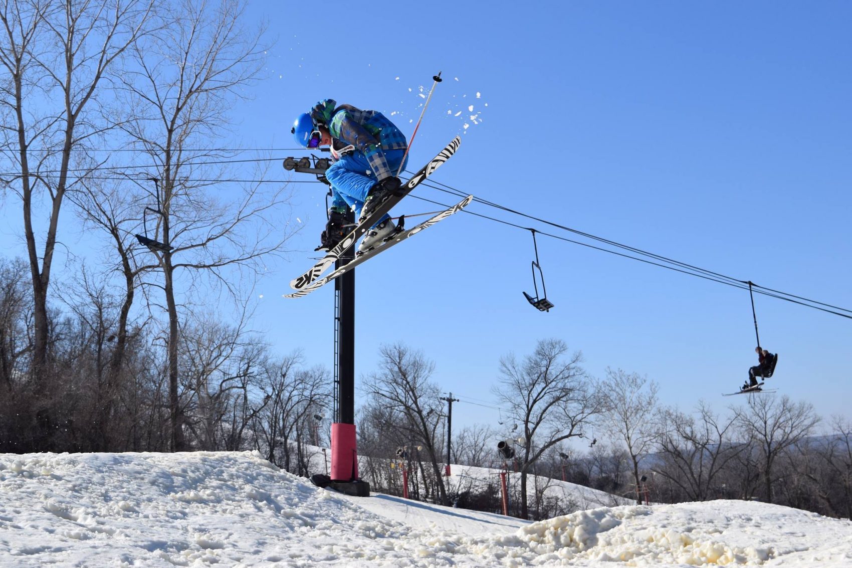 Skier jumping, snow creek, Missouri