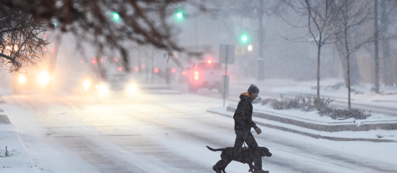 pedestrian in denvers first snow