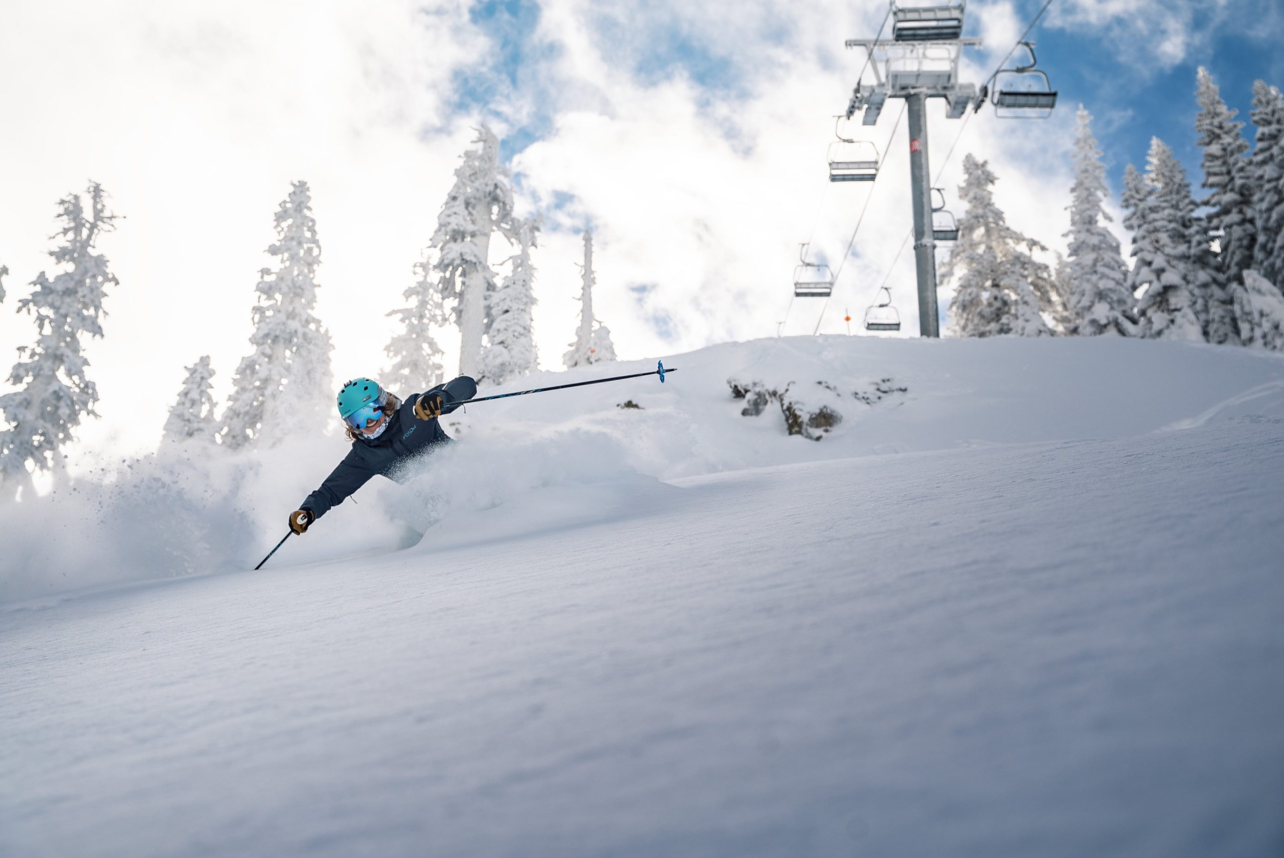 Skier turns in untouched powder