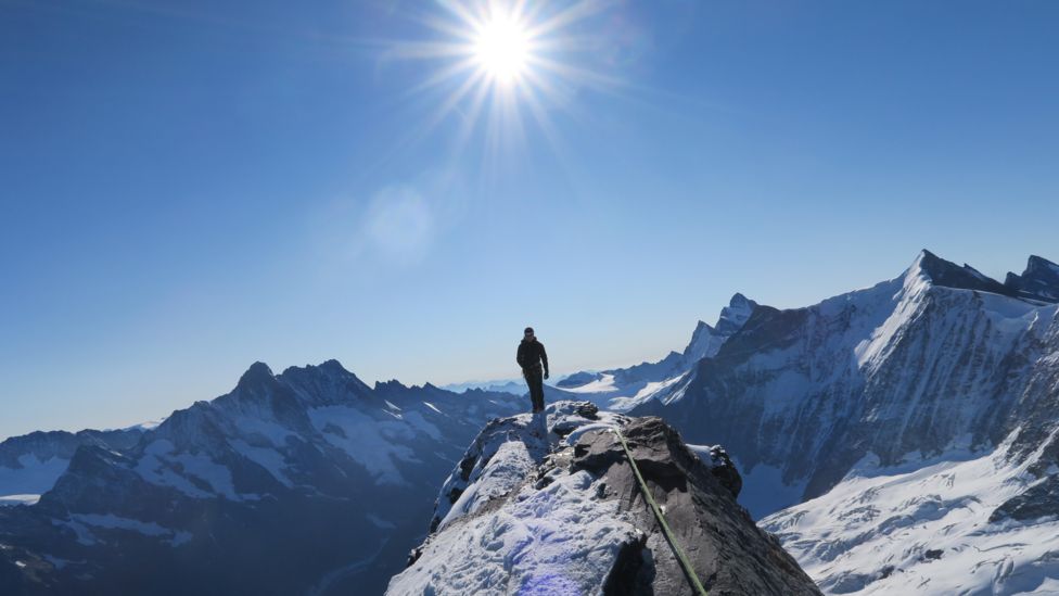 Alasdair McKenzie climbing peaks