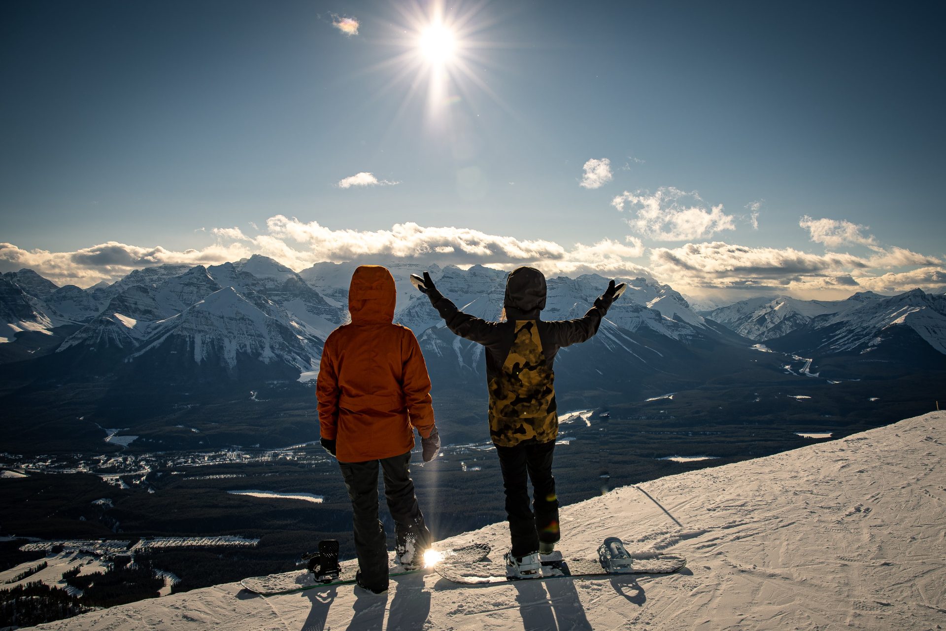 Snowboarders looking from the top of Lake Louise Ski Resort