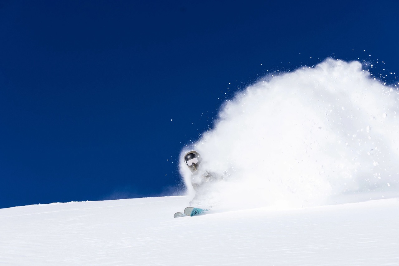 skier spraying deep powder