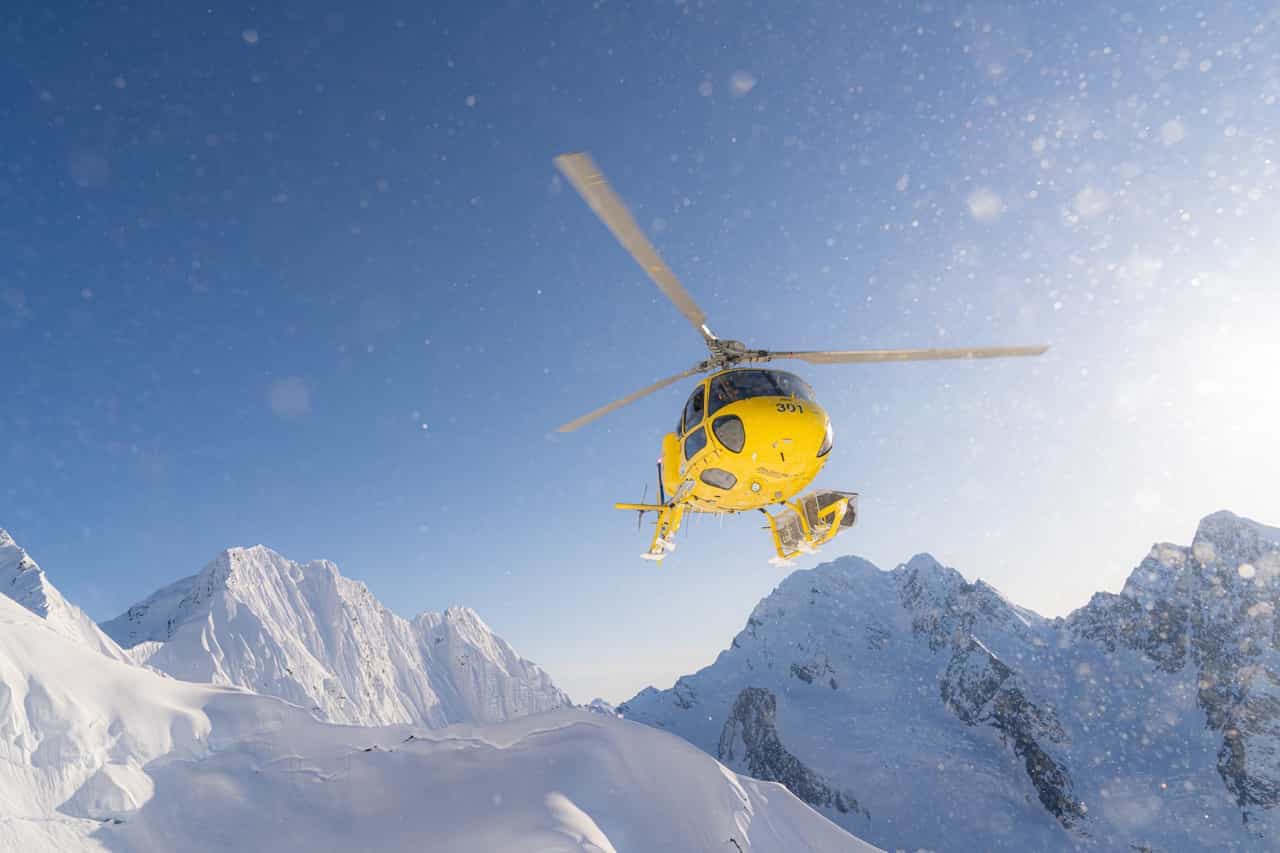 helicopter taking off from mountain with pulseline adventure