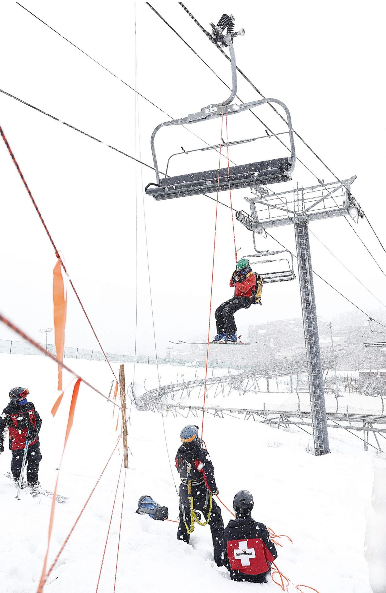 steamboat ski patrollers train to lower people to the ground with ropes if the chairlift breaks