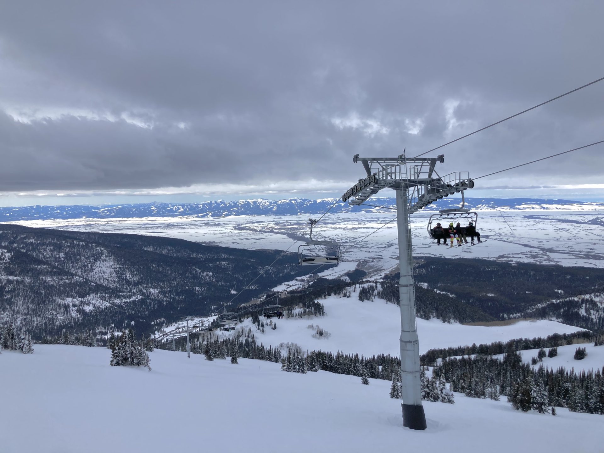 new six pack chairlift with view of Teton Valley at Grand Targhee