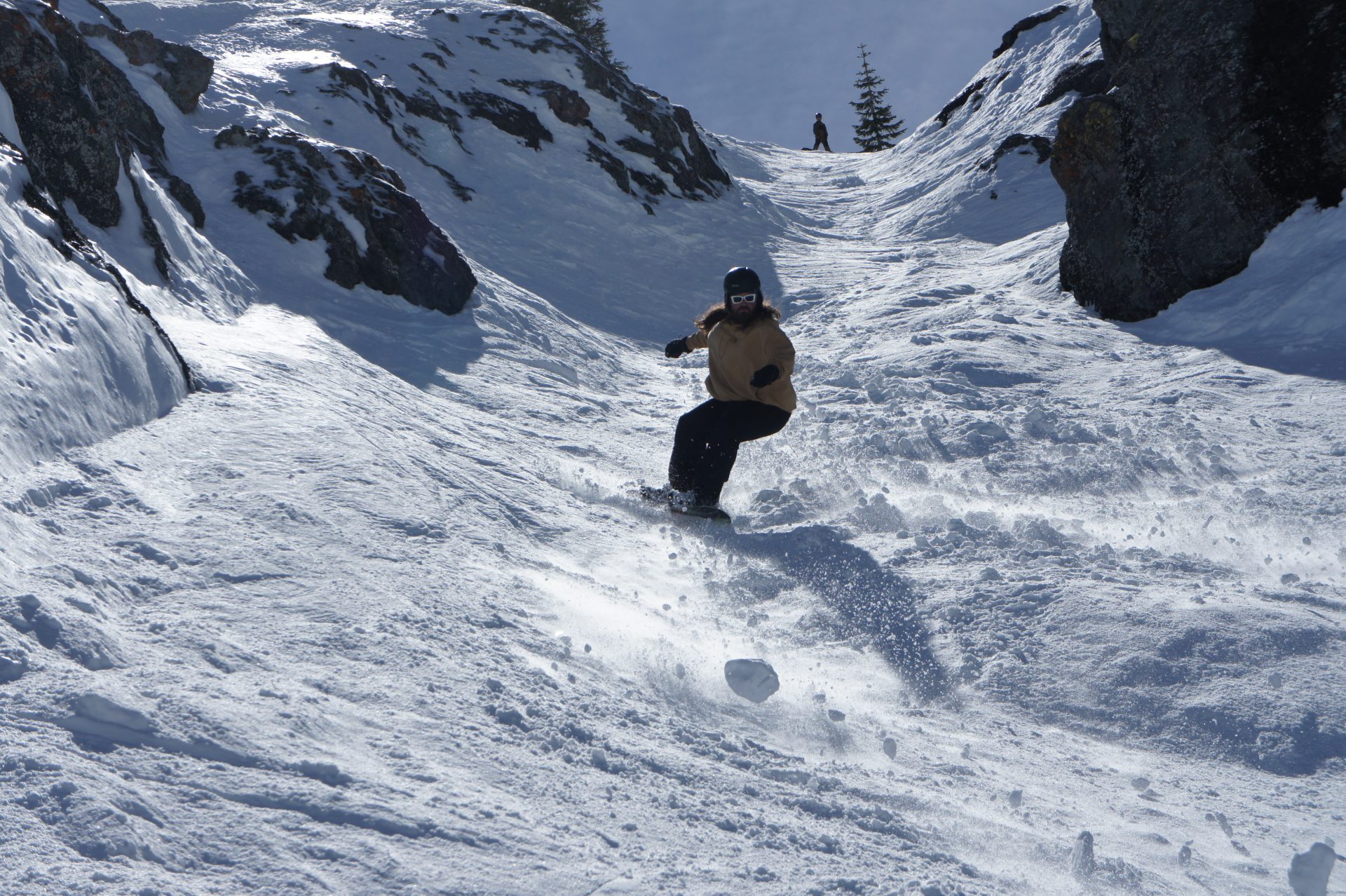 snowboarder in rock chute at palisades
