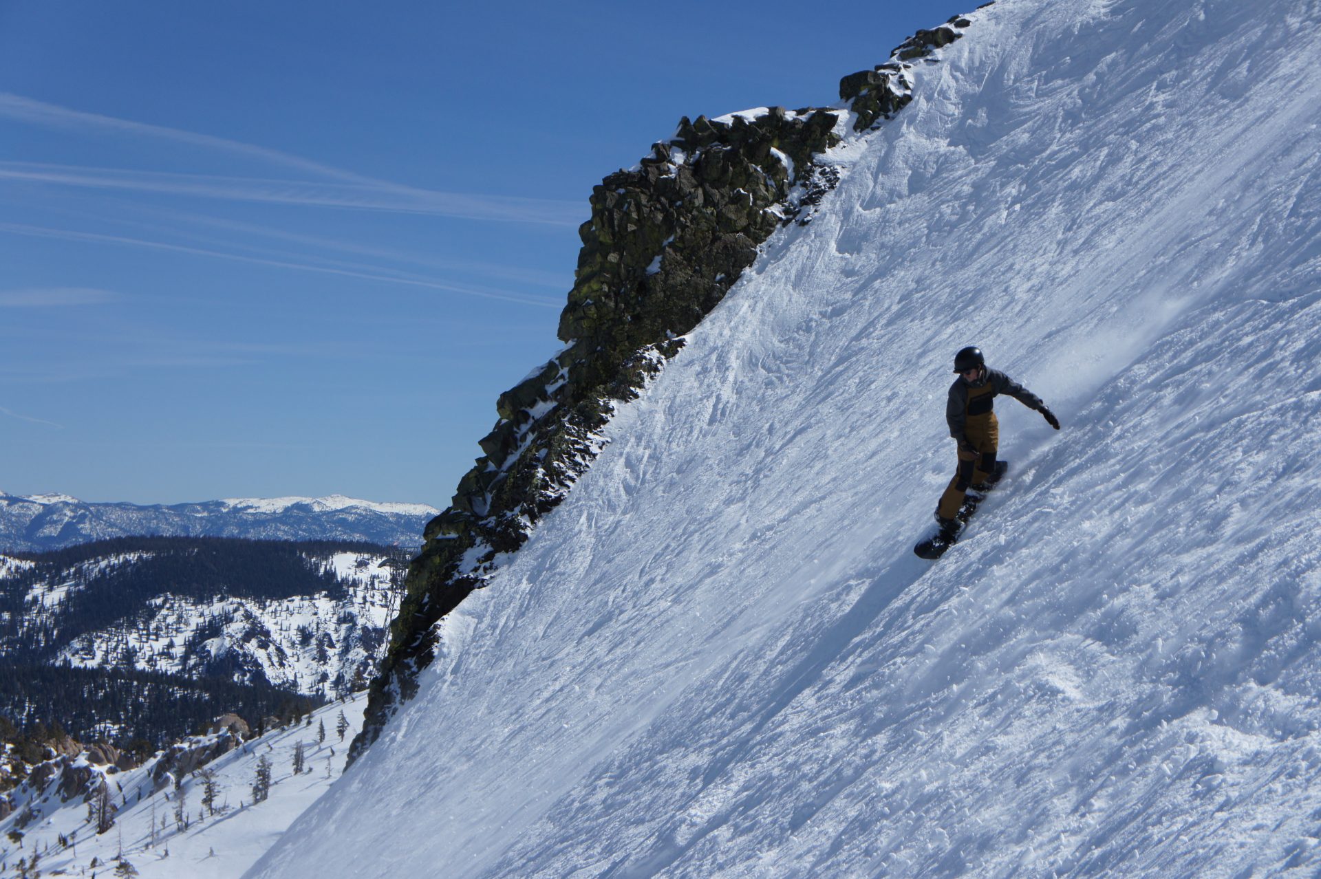 snowboarder on steep slope at palisades