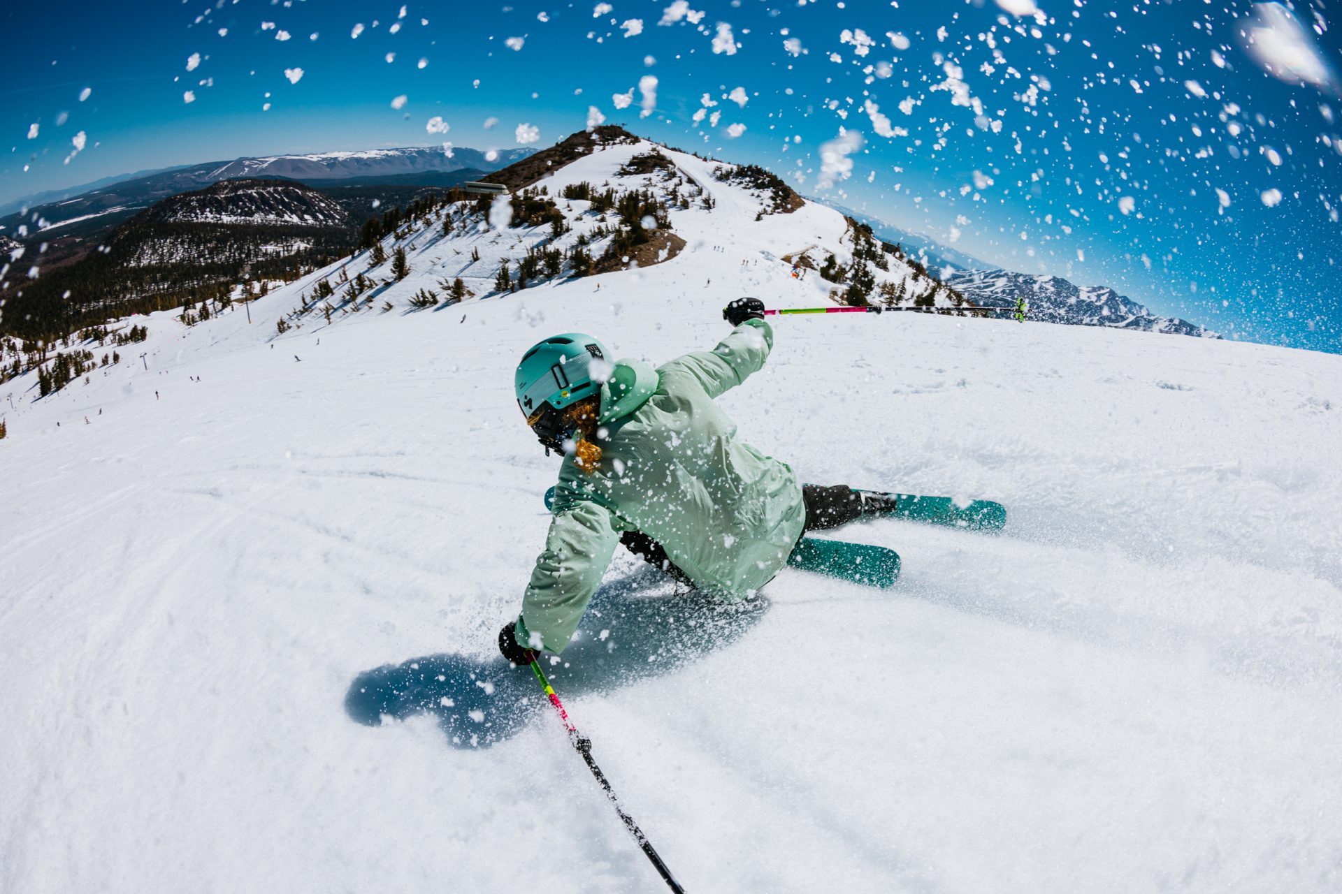 Skier carving down snowy mountain during Second Season at Mammoth Mountain this spring