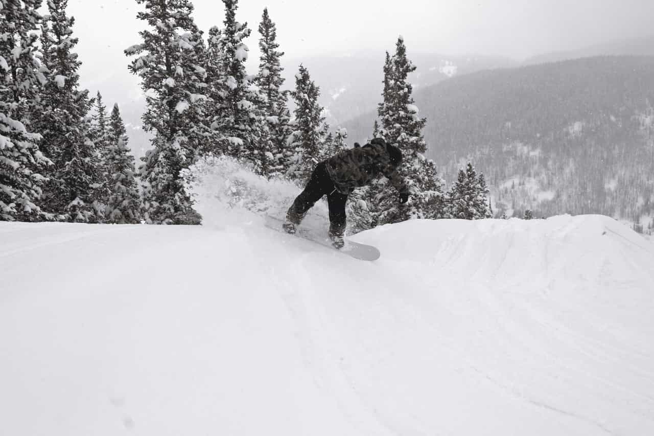 snowboarder in deep snow at copper mountain colorado in late april