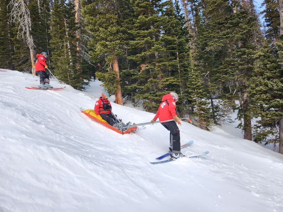 Eldora patrollers practicing with a rescue toboggan