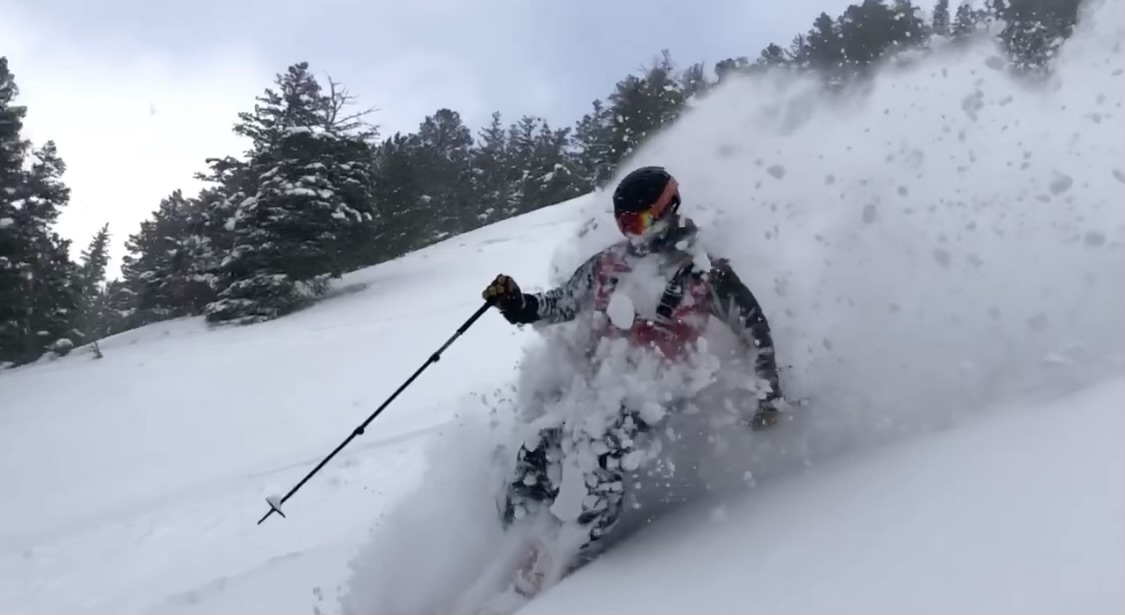 Eldora patroller skiing in deep powder