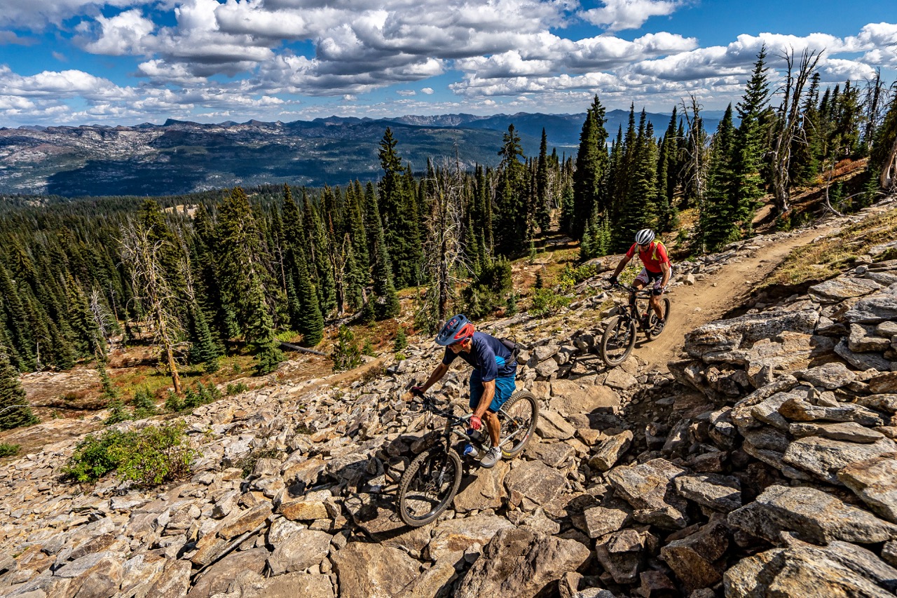 mountain bikers on rocky terrain at brundage mountain resort in the summer