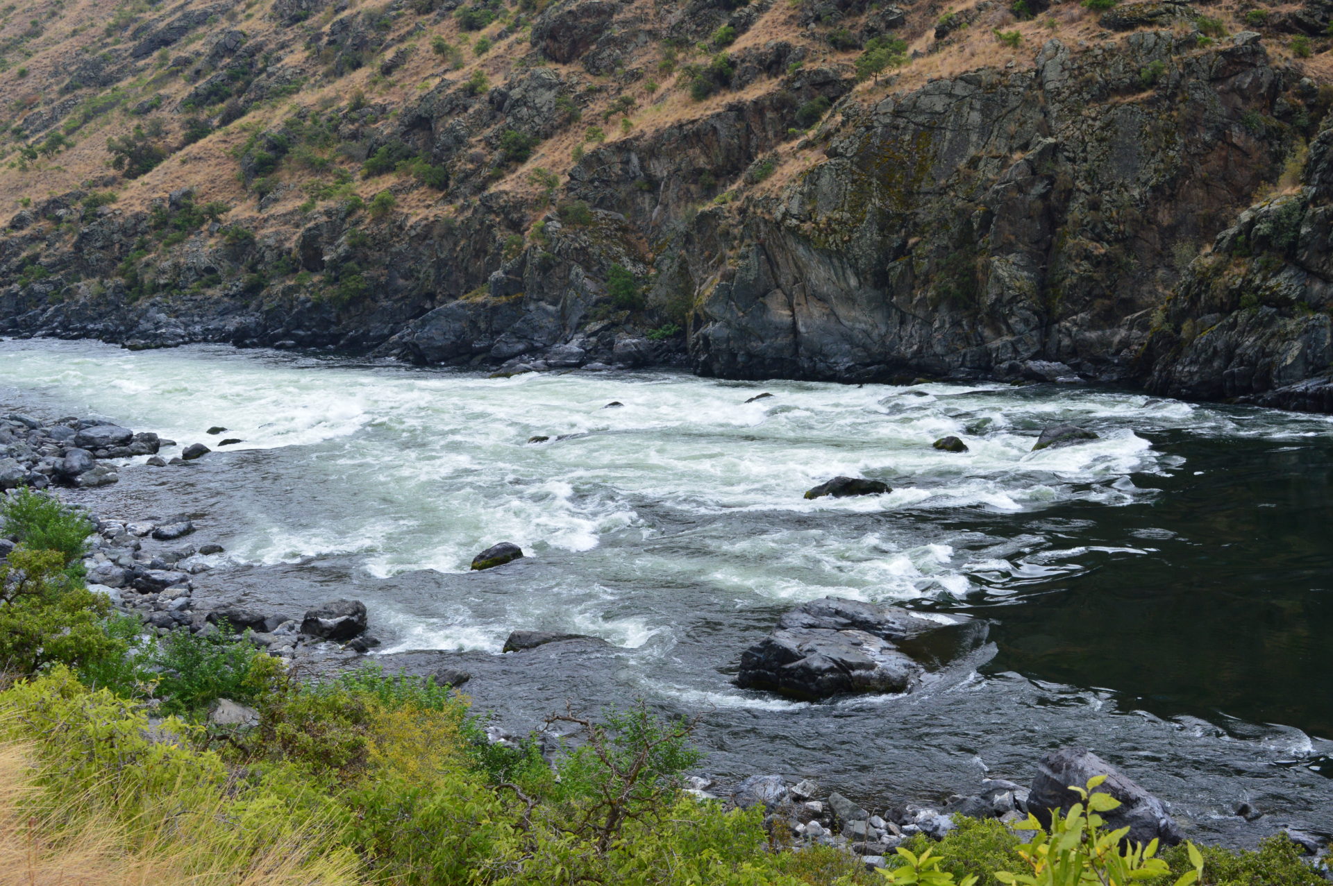 I promise the river is much more rowdy than it looks from ashore. Photo Credit: SnowBrains