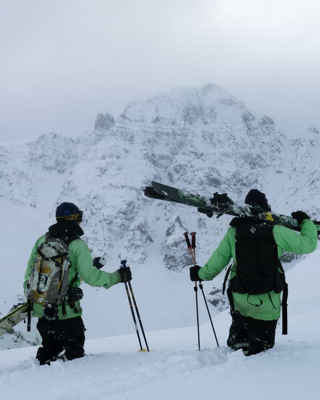 first turns of the season at Silverton Mountain siers stood in deep snow looking at the mountains