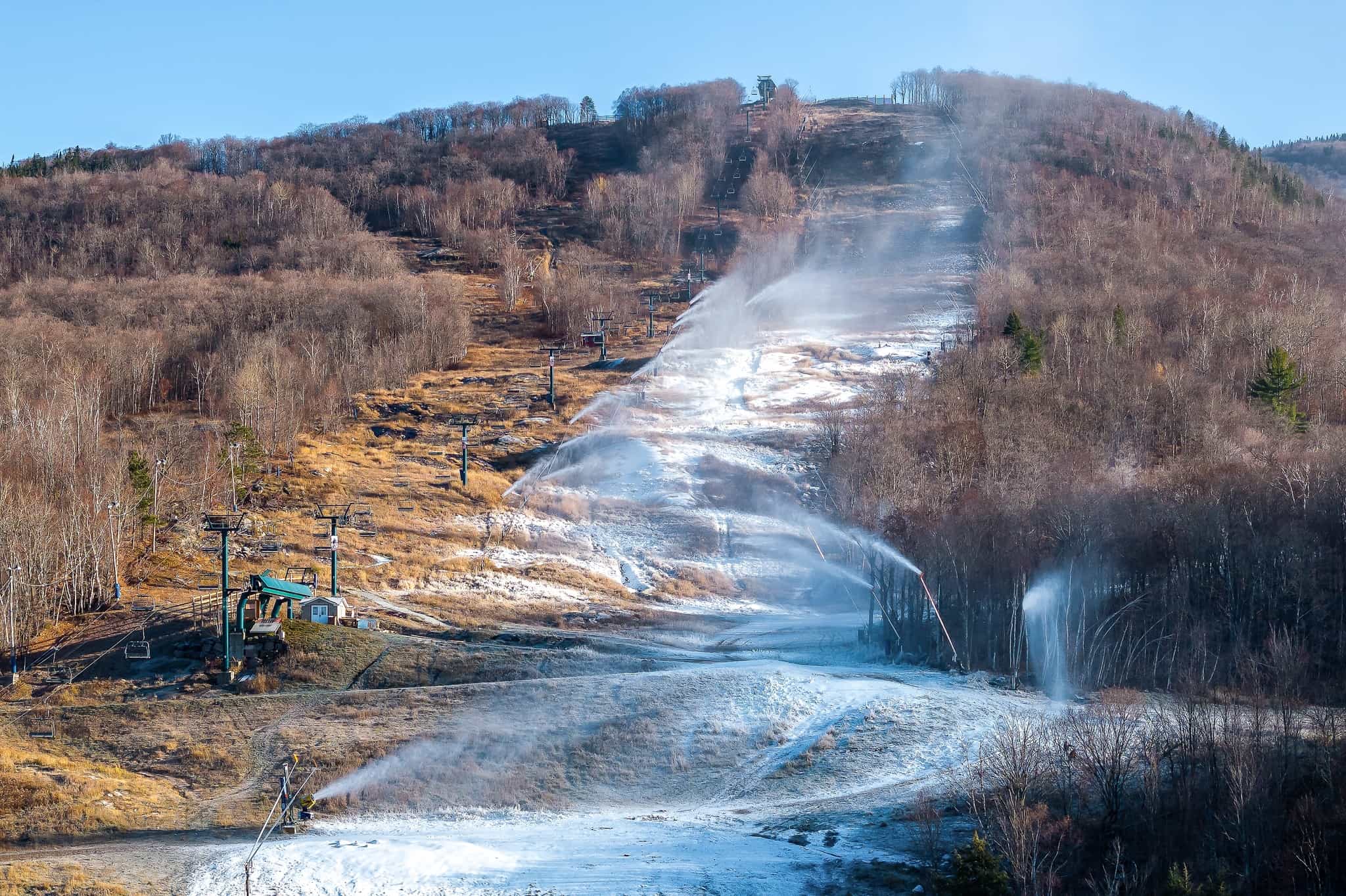 snowmaking on dry mountain slope at tremblant in quebec ahead of postponed opening day