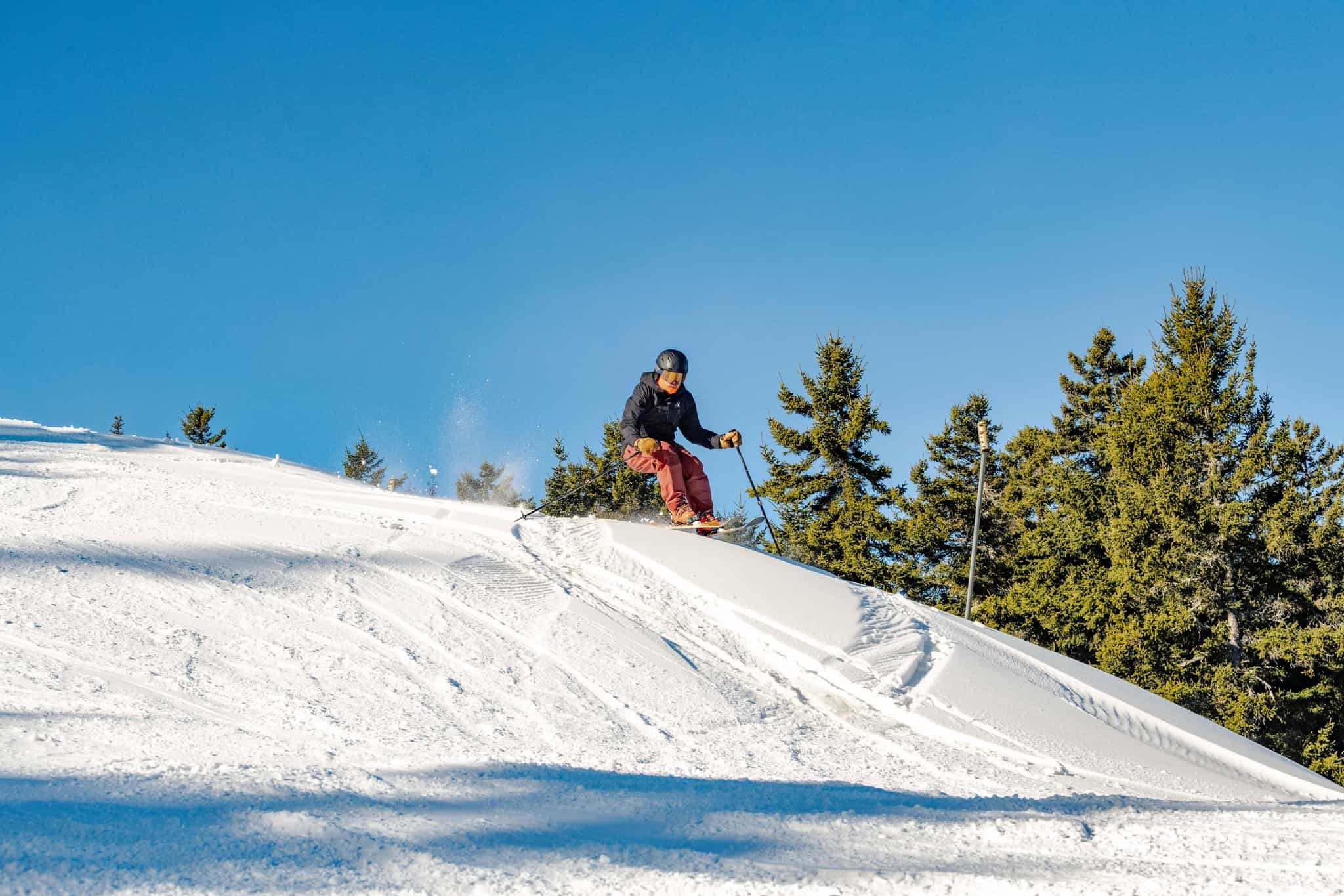 skier on opening day at Sunday River in Maine