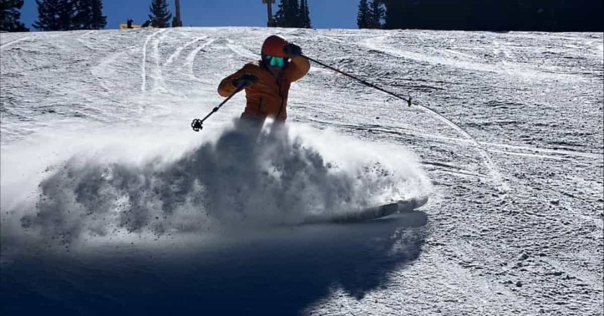 skier at vail mountain colorado spraying snow