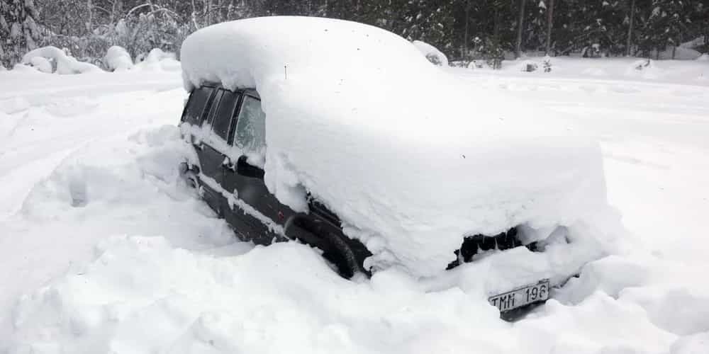 Car stranded in deep snow during Colorado blizzard