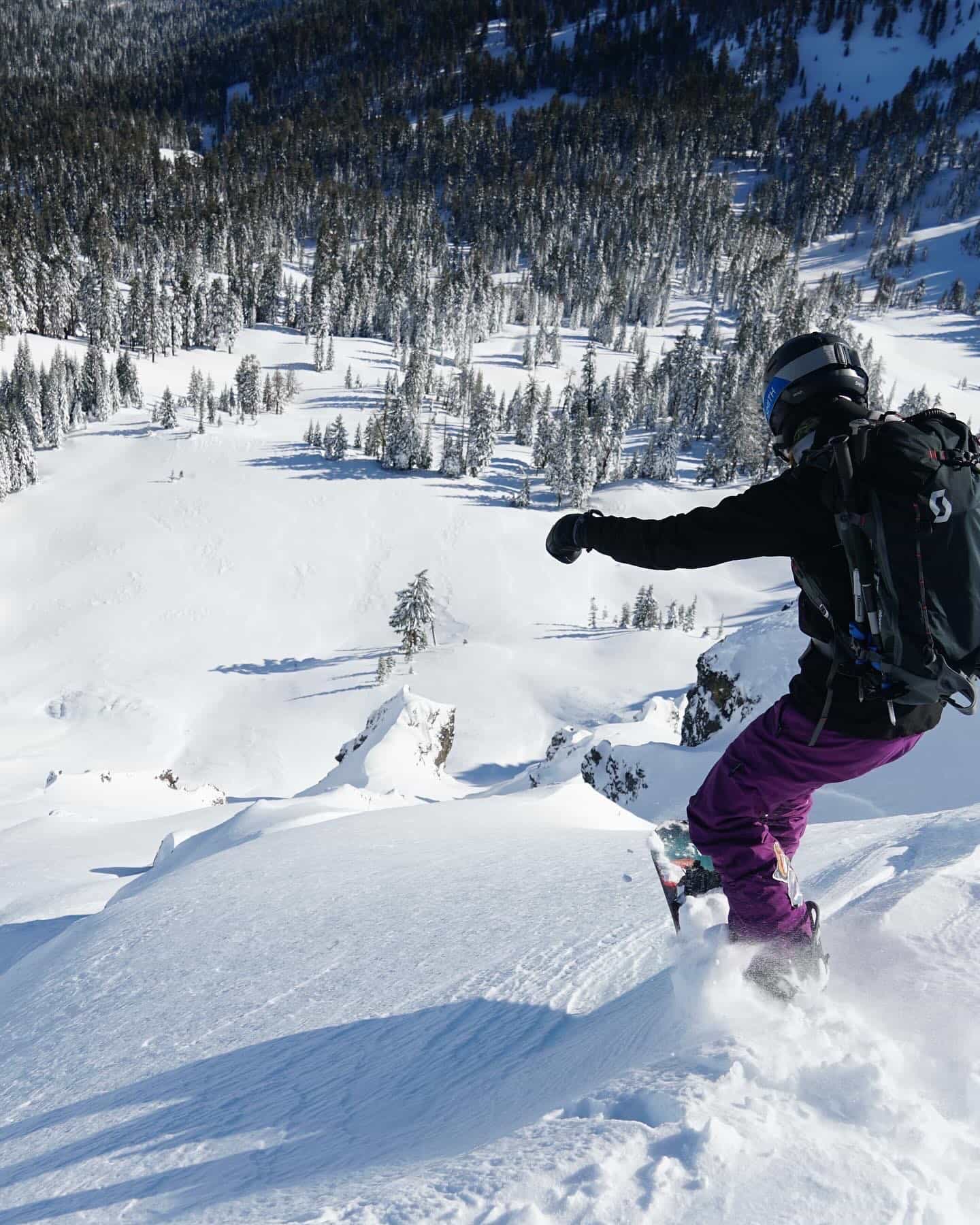 snowboarder in the Tahoe backcountry in fresh deep snow 