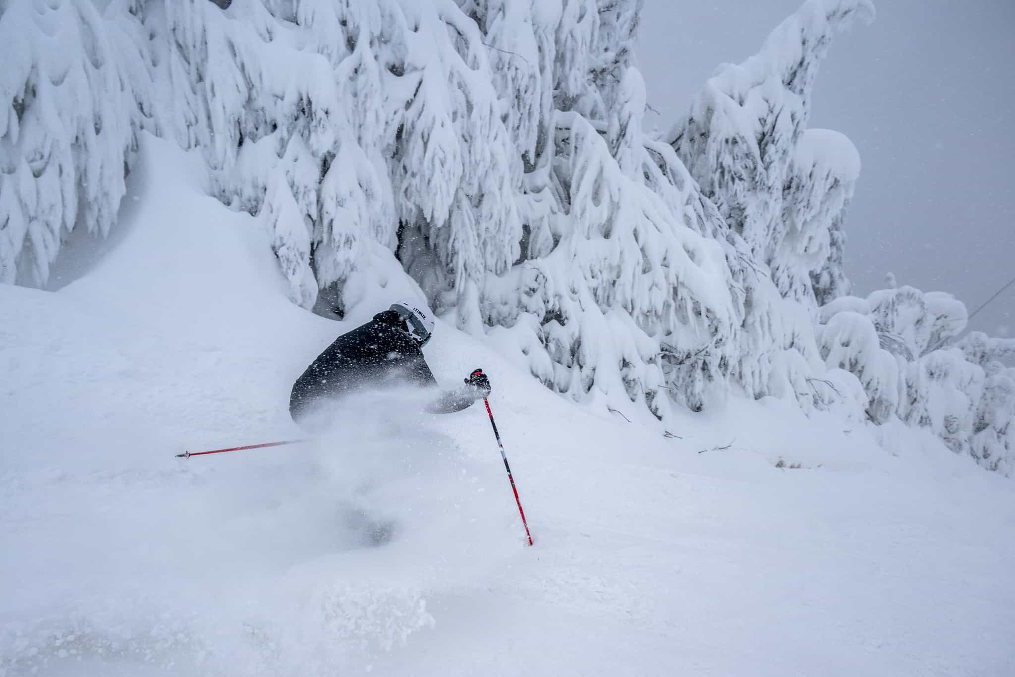 skier in deep snow at Mont tremblant in Quebec Canada