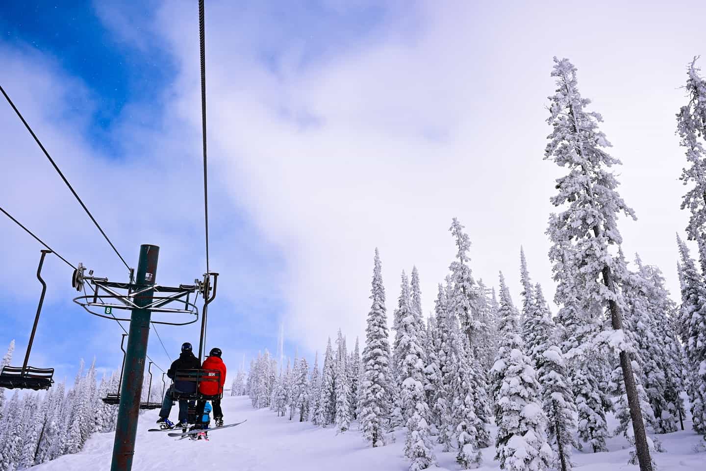 Skiers on a chairlift at Montana Snowbowl | Photo: Montana Snowbowl Facebook