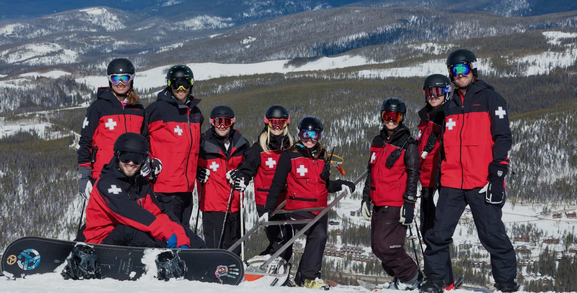 group of ski patrollers on a snowy mountain