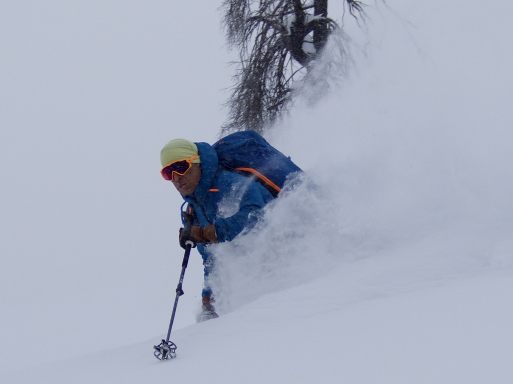 backcountry skier in deep pow