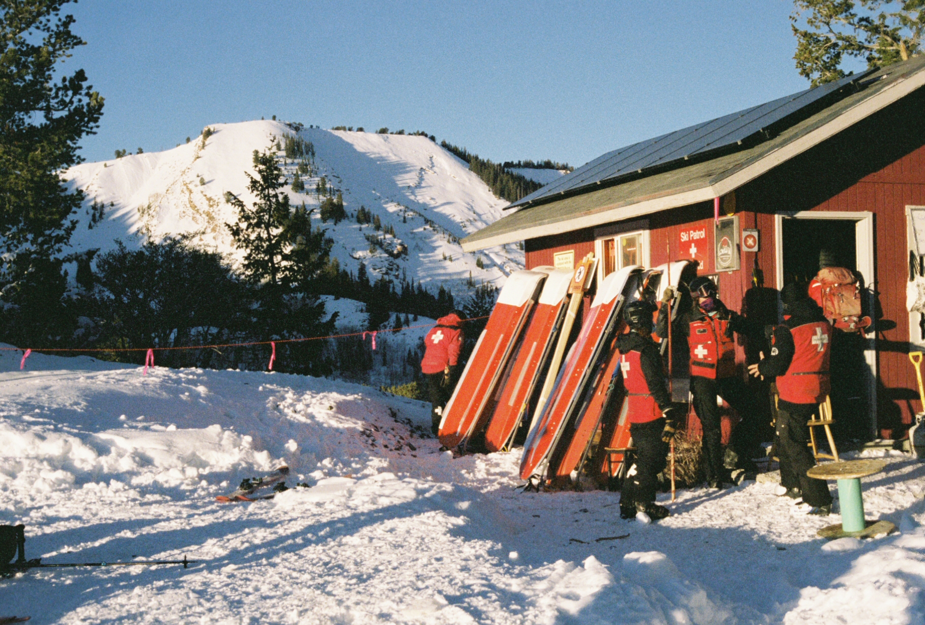 ski patrollers outside top shack